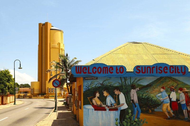 San Nicolas, Aruba's Sunrise City: the yellow Art Deco water tower and the Welcome to Sunrise City mural